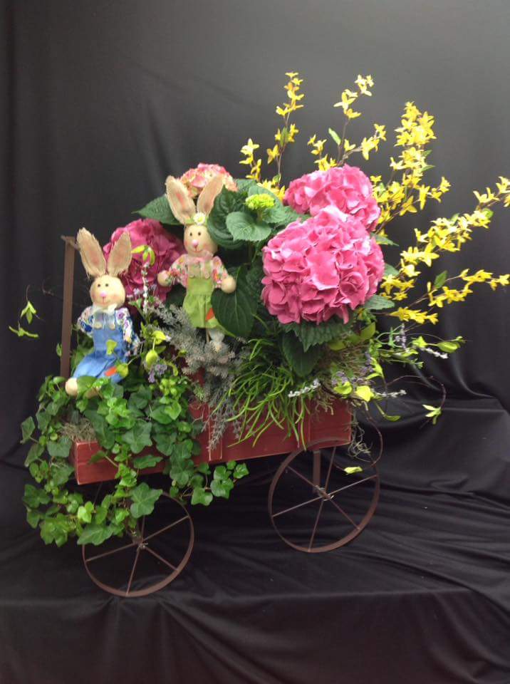 Bunnies On A Cart With Flowers