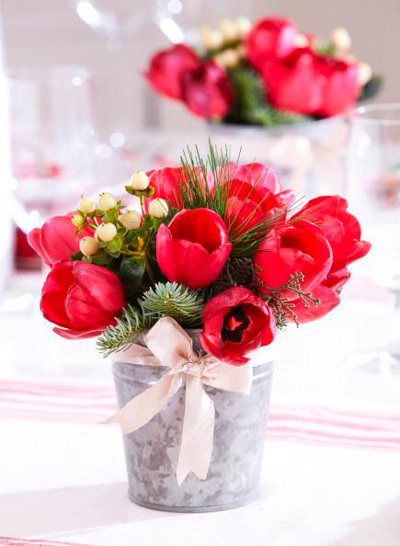 Floral center with red tulips and holly.