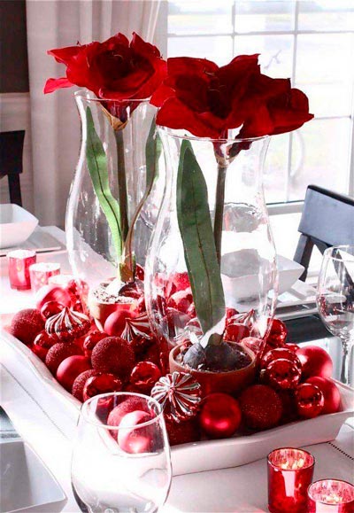 Red flowers decorated with Christmas tree balls.