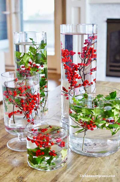 Several Christmas centers with holly floating.