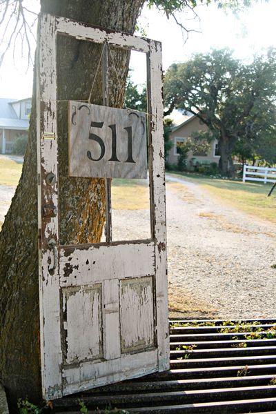 House Numbers Hanging From An Old Door