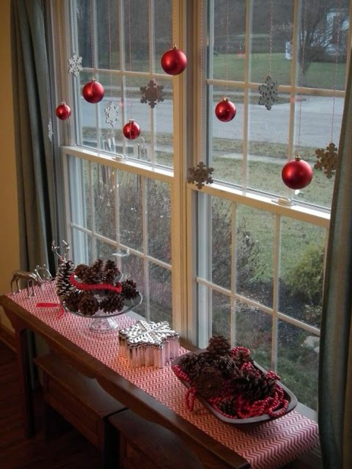 Red hanging balls and elegant white snowflakes