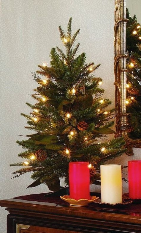 #Small #Christmas #Tree tiny tabletop tree decorated with pinecones and lights