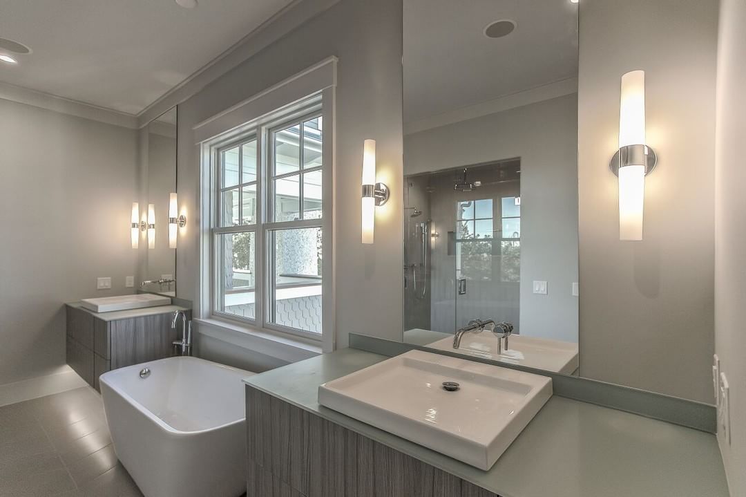 Kohler sinks with glass countertops and floating twin vanities. Pic by lorrainegvaledesign