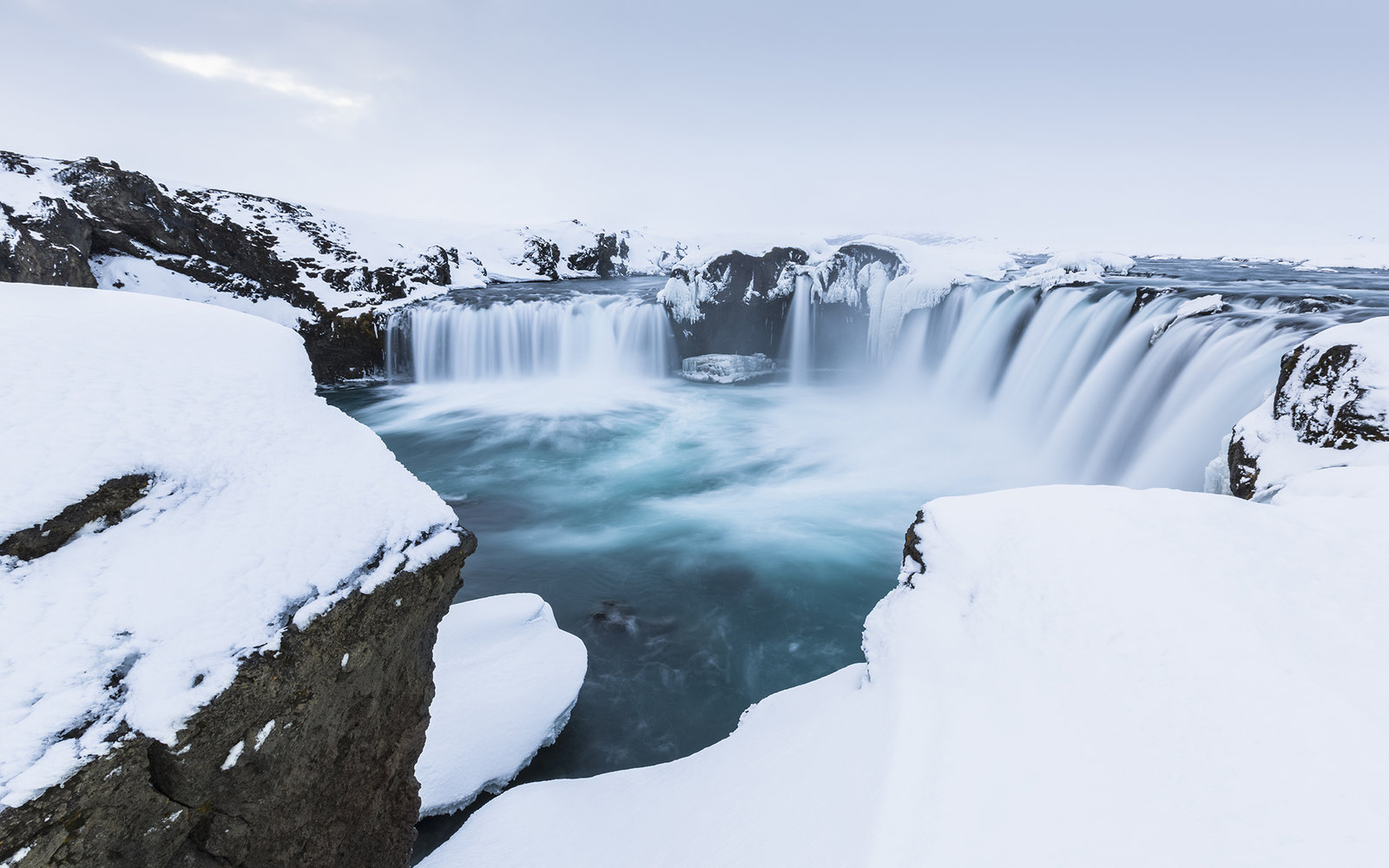 Waterfalls in snow, Godafoss, Iceland