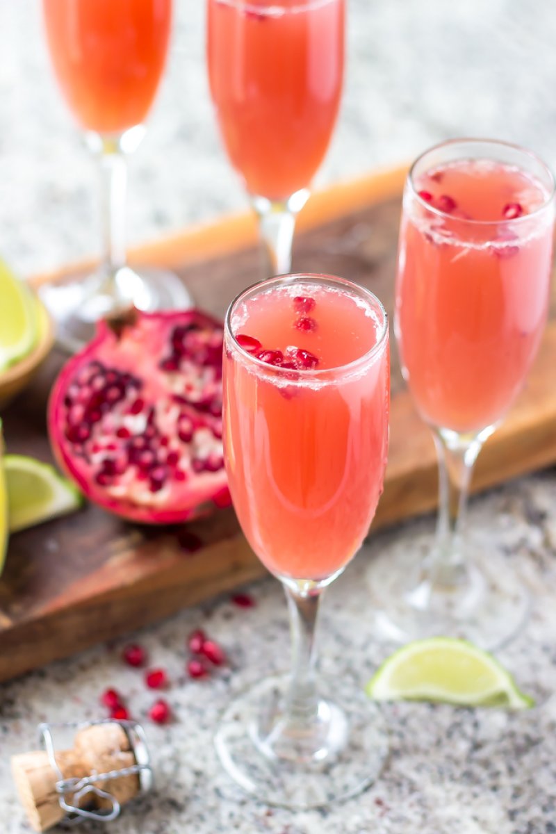 Mexican Pomegranate Mimosas - Orange juice, pomegranate juice, lime juice, tequila