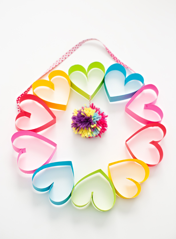 DIY rainbow paper heart pom pom wreath.
