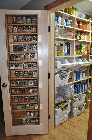 An amazing pantry with clever door storage.