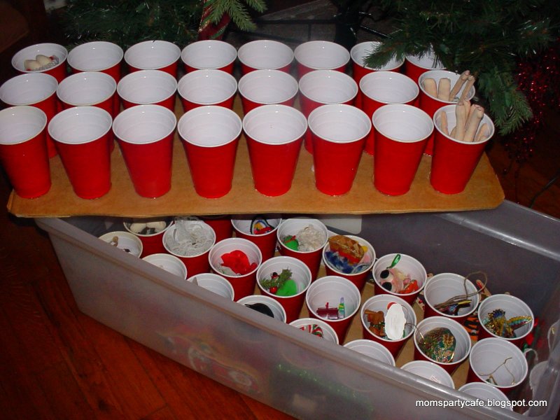 Glue plastic cups to cardboard and cut to fit the box.