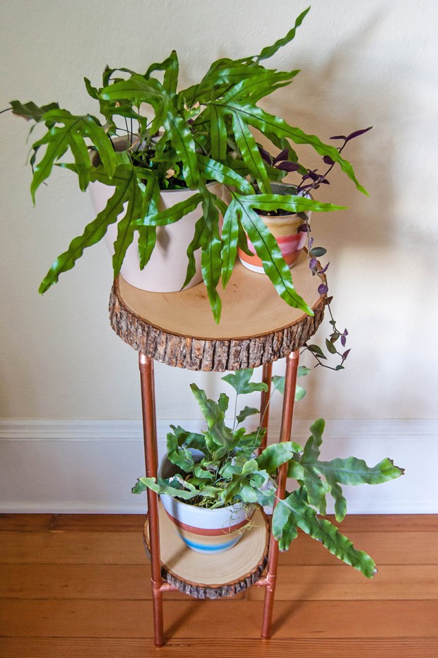Make a side table or plant stand out of copper pipe.