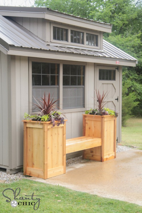 Planter box bench has two planters one at each end.