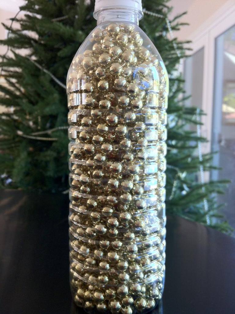 Put beaded garland in an empty water bottle.