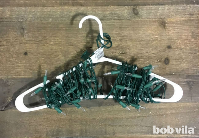 Wrap Christmas Lights Around a Hanger for Tangle Free Storage.