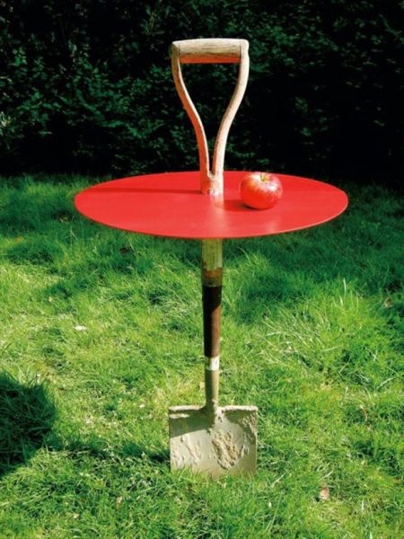 An old shovel is perfect to use to make a portable garden table.