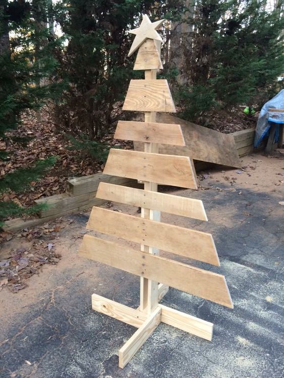 Arranged pallet as tree with star tree topper.