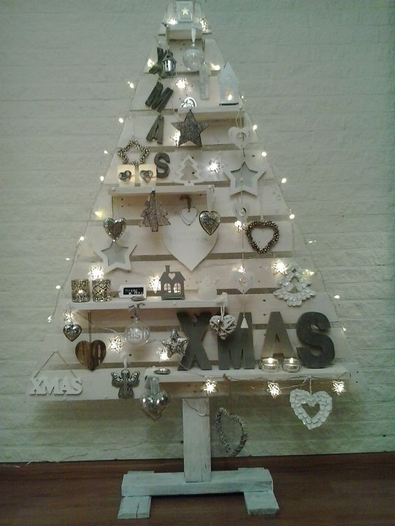Beautiful white painted and decorated wooden Christmas tree.