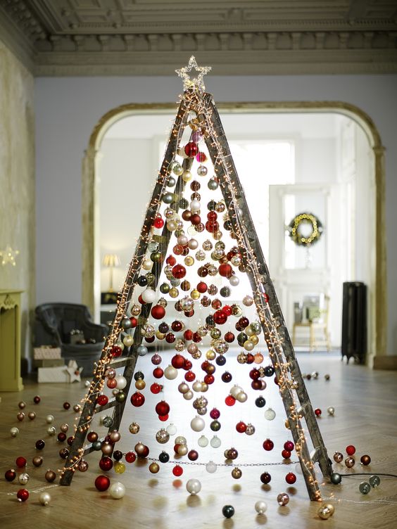 Fabulous wooden tree made by ladder decorated with colorful balls.