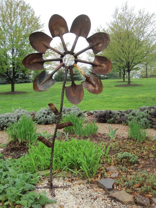 Floral garden sculpture from old shovel heads.
