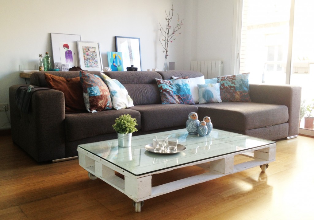 Make a Pallet Coffee Table with Glass Top and Wheels.