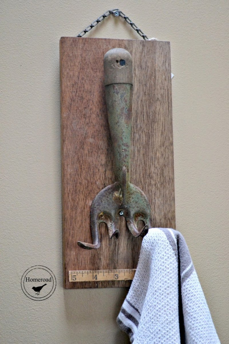 Old hand rake as a towel holder.