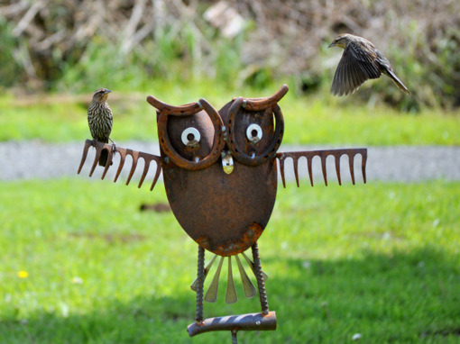 Owl yard art made from old rake.