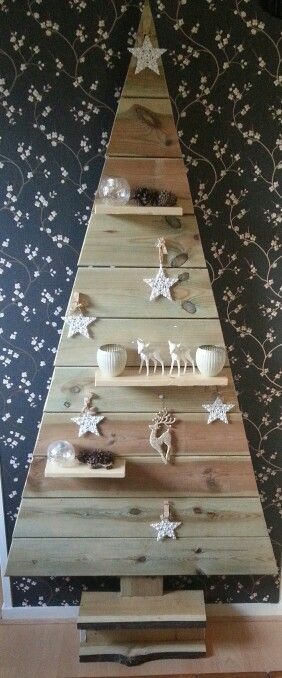 Shelf style pallet tree for Christmas for carrying ornaments.