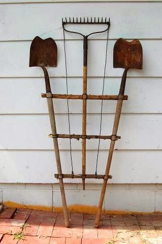 Trellis with old garden tools.