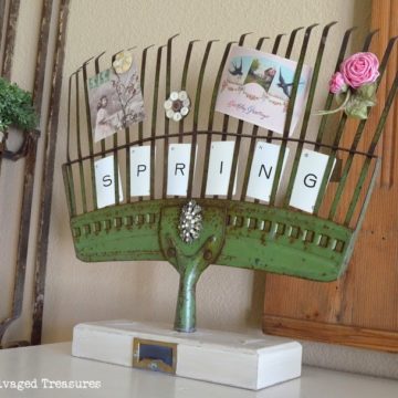 Turn an old rake into a picture holder.
