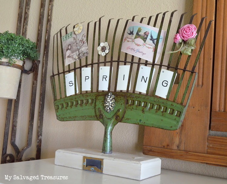 Turn an old rake into a picture holder.