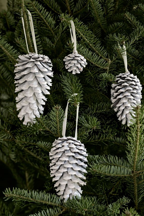 White spray painted pincone ornaments.