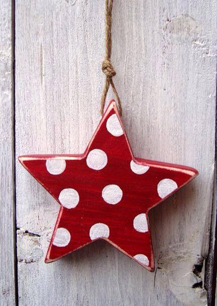Wooden star painted in red and white polka dots star ornaments.