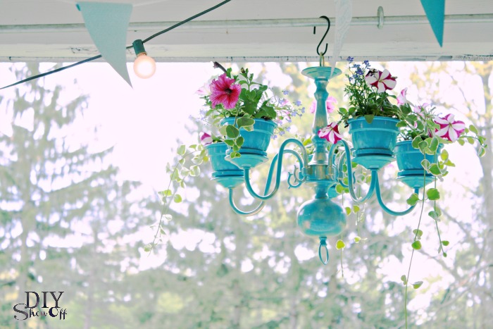 Use old chandelier to make this awesome hanging planter!