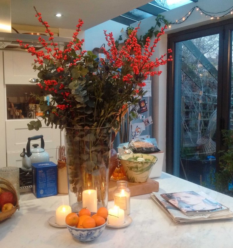 Christmas comes to the kitchen, with eucalyptus and ilex berries.