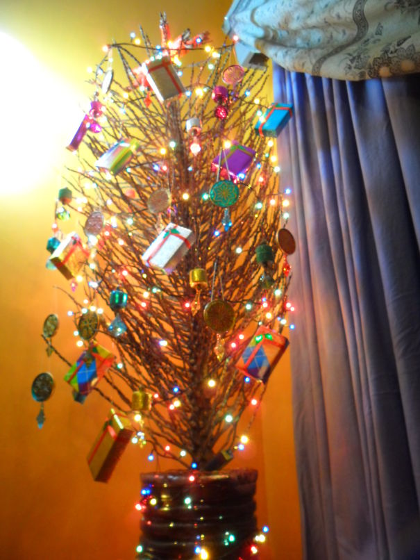 Home-made Christmas Tree From A Coconut Branch, Decorated With Handmade Ornaments From Recycled.