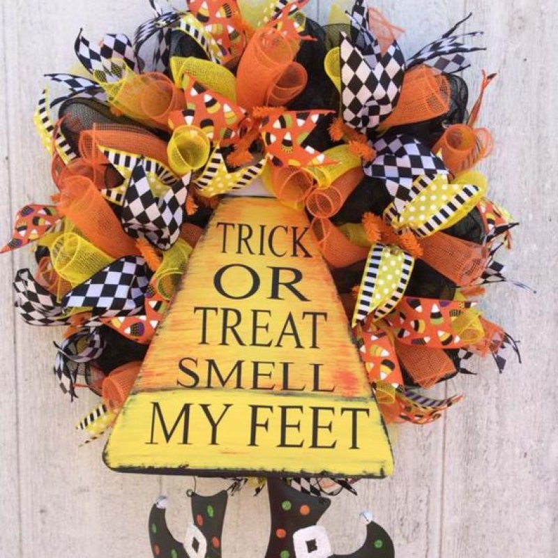 Candy Corn Wreath with Burlaps Ribbons and Witch Boots.