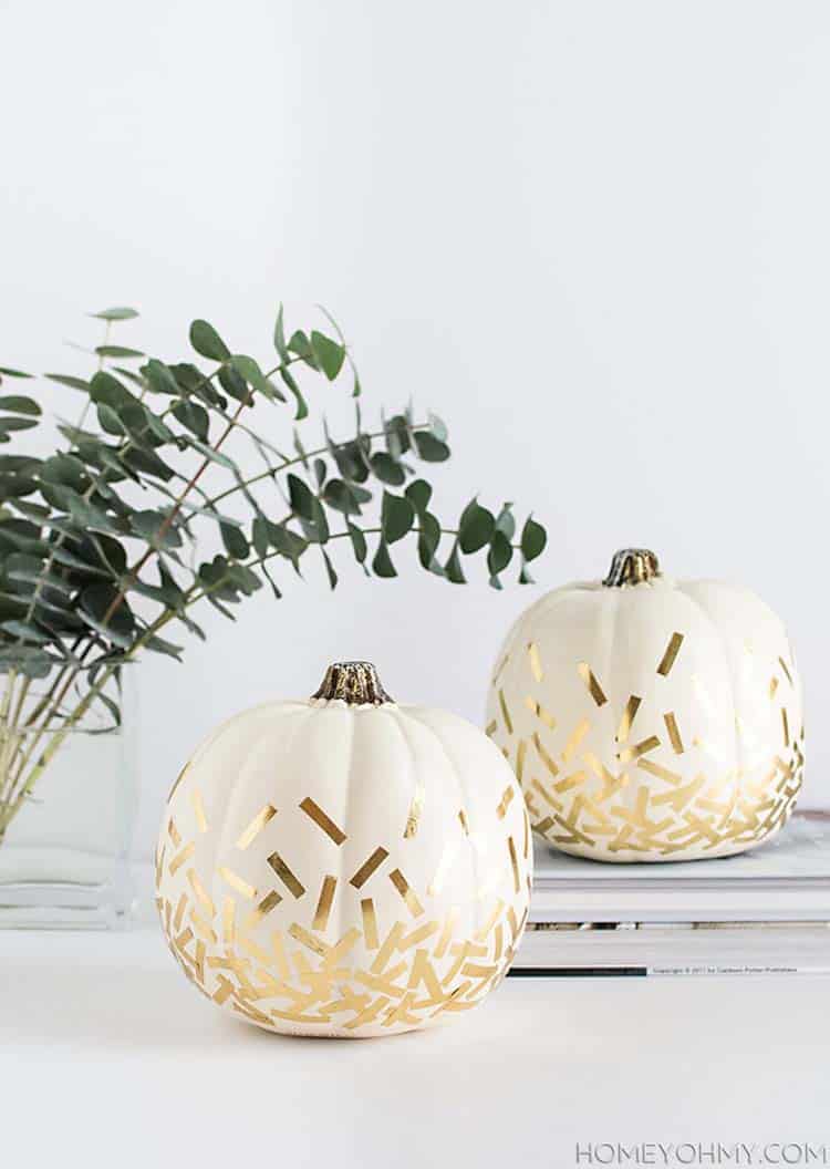 Dress up your white pumpkins with gold confetti.