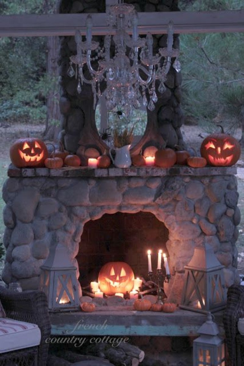Fireplace Decorated with Pumpkin Carvings.