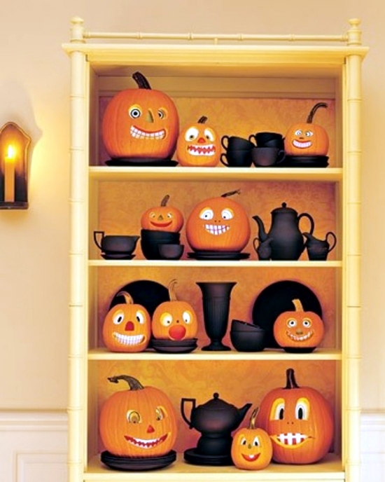 Funny pumpkin decorating in the cup rack