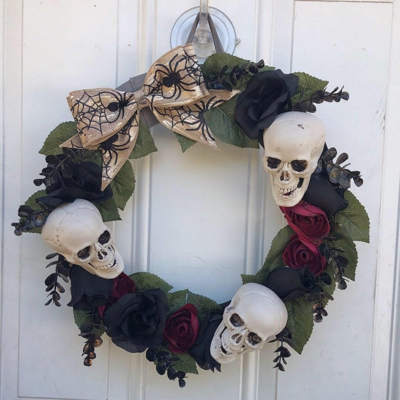 Golden Bow with Spiders and Skull with Floral Wreath.