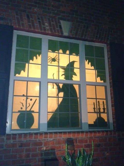 Halloween Window Treatment. Covered the window with green tissue paper and cut shapes from construction paper.