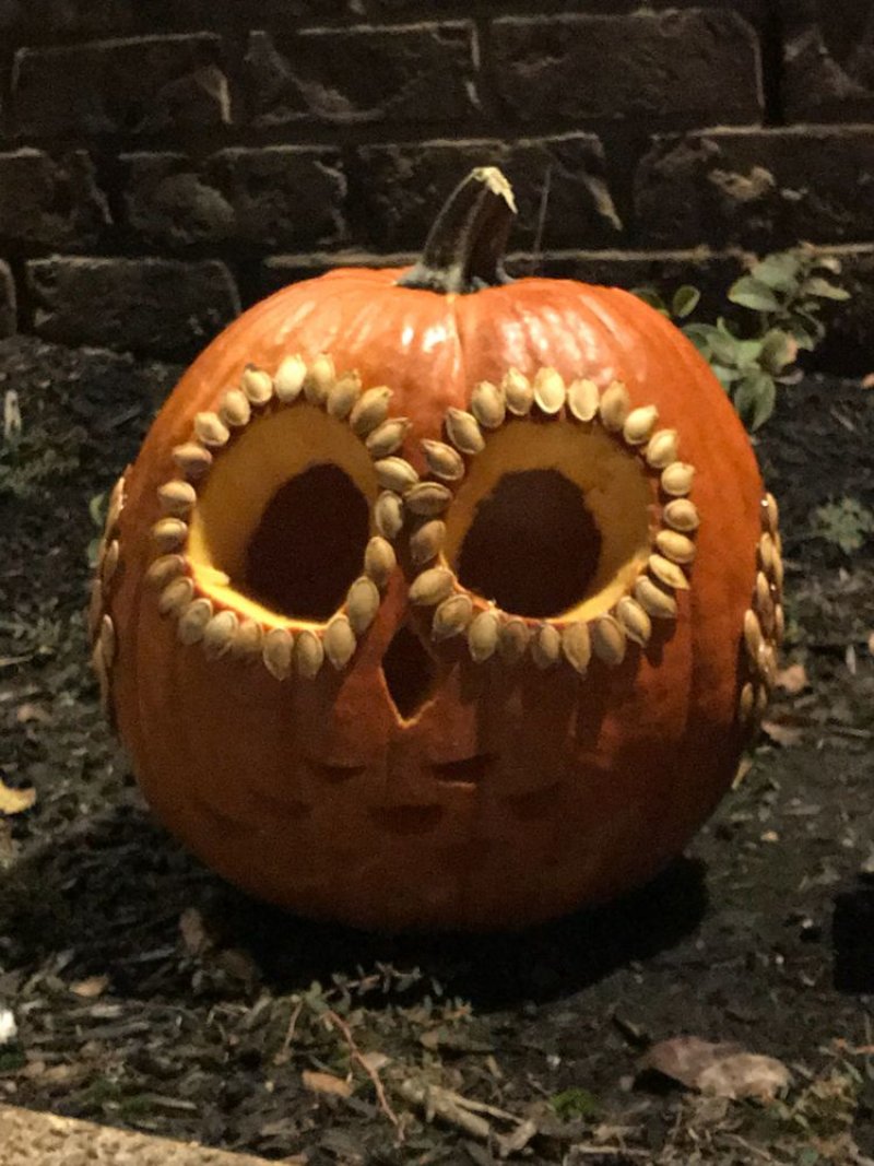 Hot glue to glue on the pumpkin seeds.