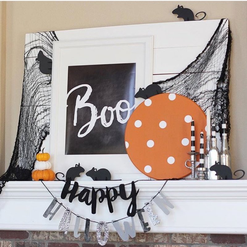 Orange, Black, and White Combination Mantel Decoration.