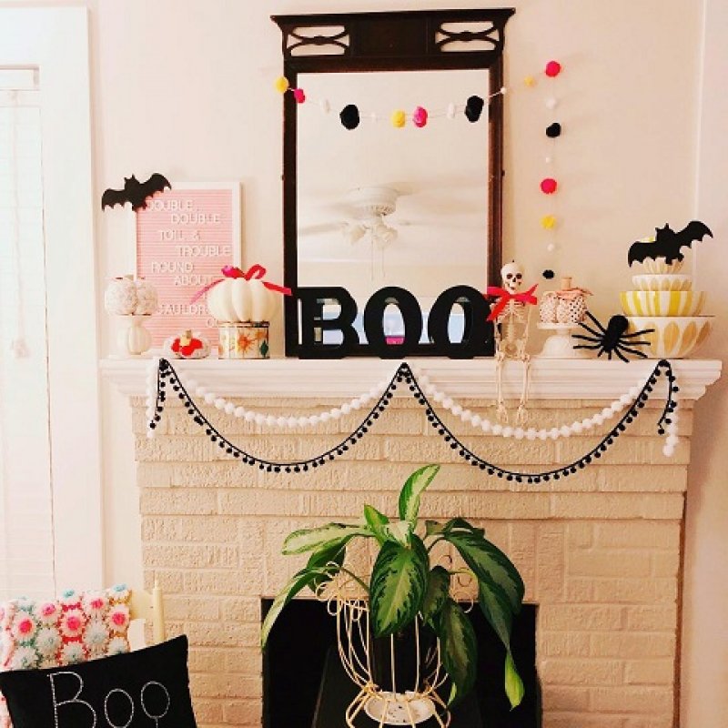 Pom Pom Garland, Bat Stickers and Tiny Skeleton Mantel Decor for Halloween.