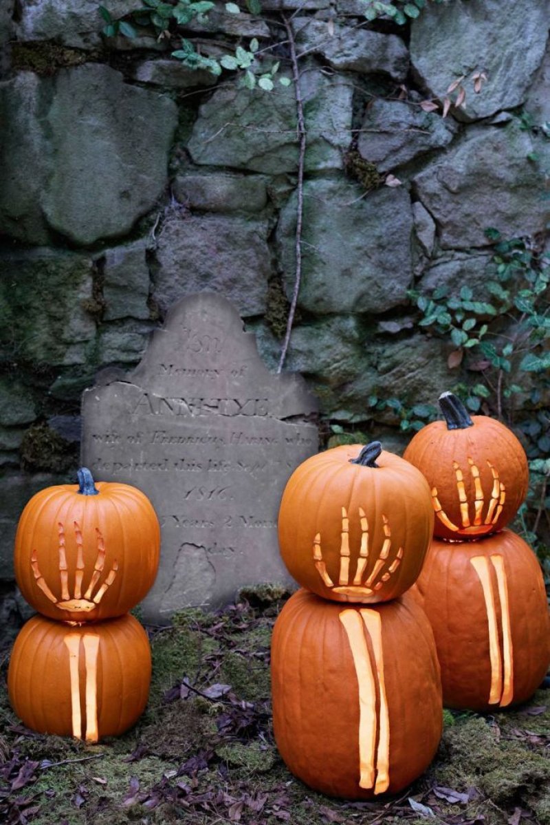 Skeleton Hands Carved Pumpkins.