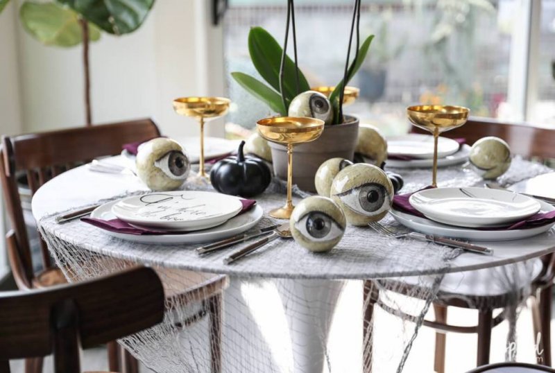 Wicked and eclectic Halloween table setting.