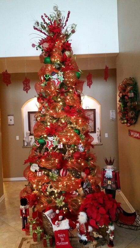 Baby Ian under Nanas Christmas tree.