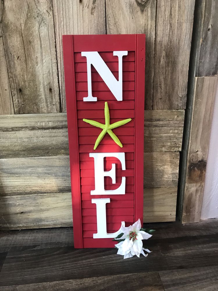 Beautiful decorated Christmas shutter doors for wall art! It says Noel.