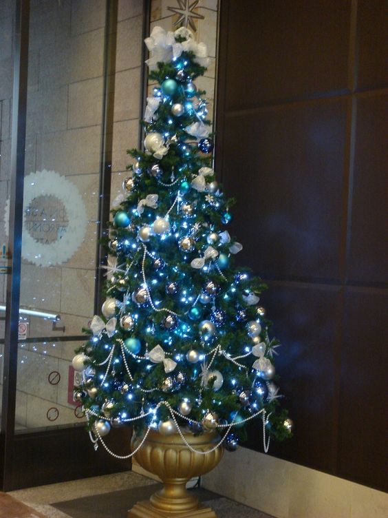 Blue Christmas tree in an urn.