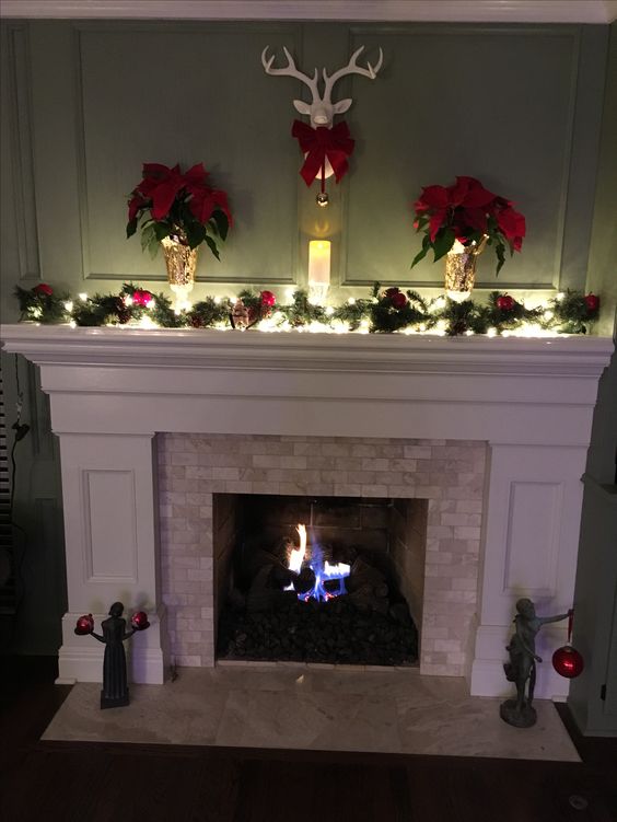 Christmas mantle with deer head.