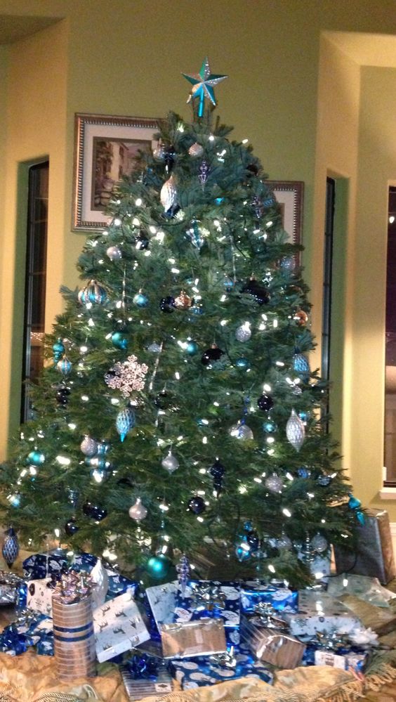 Christmas tree decorated with cobalt blue, aqua and silver. Martha Stewart decorations from Home Depot.